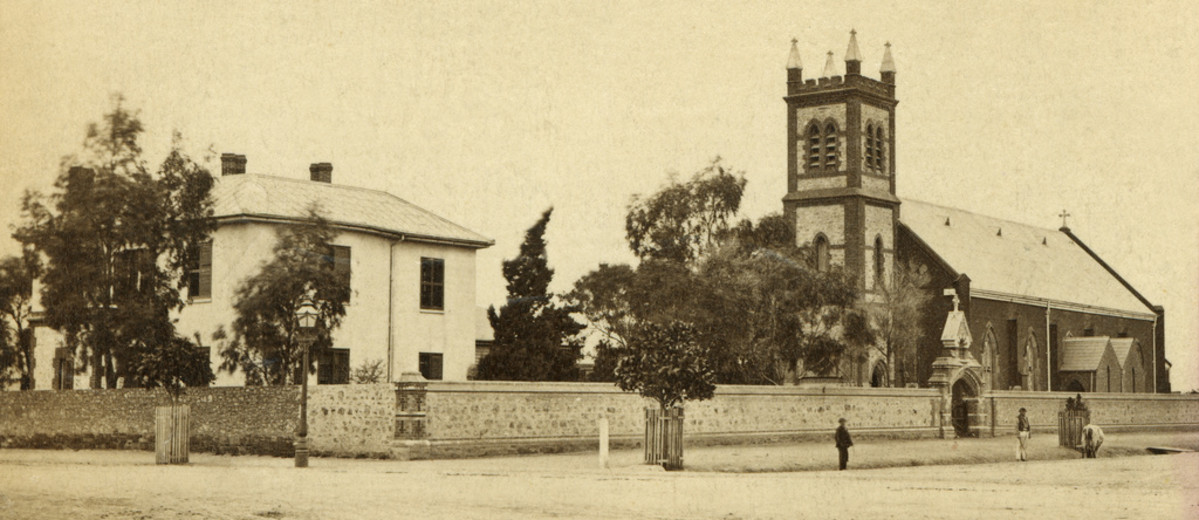 Image: street view of Grote street, showing Archbishop's House to the left, and Saint Patrick's Church to the right.