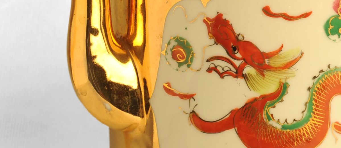 Image: red painted dragon on gold teapot