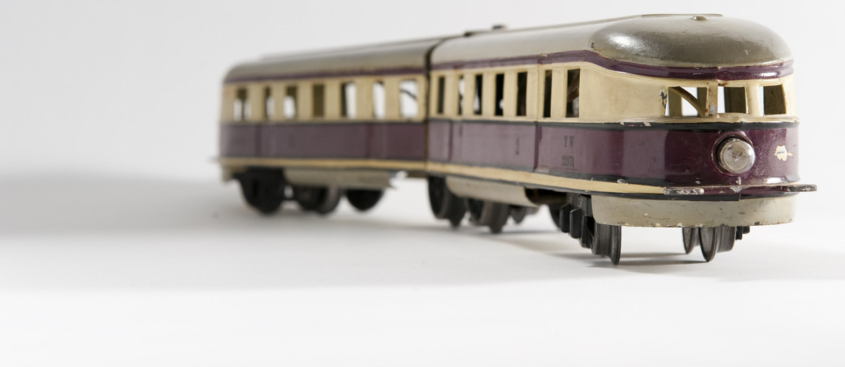 Image: brown and green tin toy train