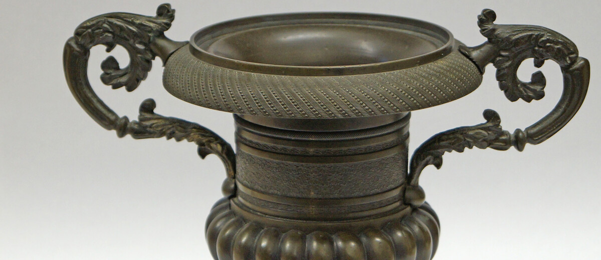Image: Hellenic vase shaped bronze urn on square base