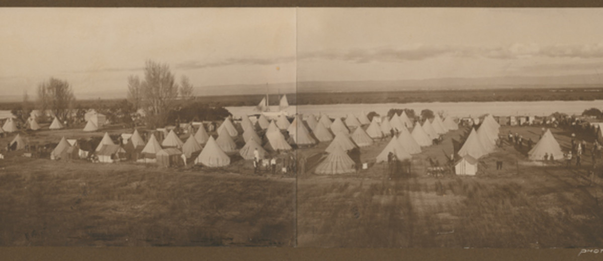 Image: black and white photo of group of tents