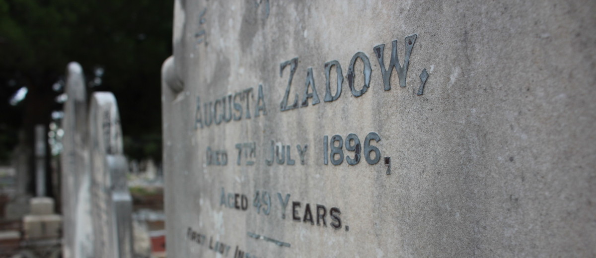 Image: engraved grey stone grave headstone