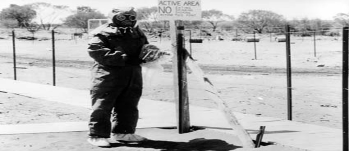 Image: man in protective clothing at Maralinga