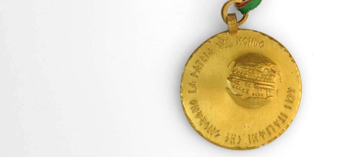 Image: bronze medal with striped ribbon