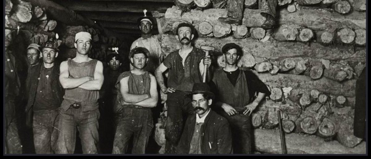 Image: Men working in mine pose for photograph