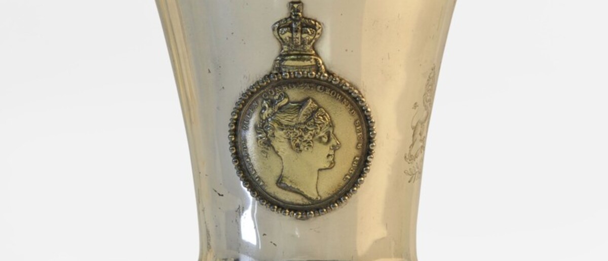 Image: silver cup with image of a woman on side