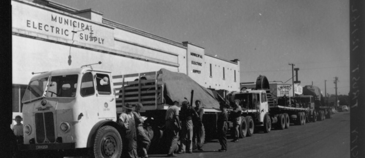 Image: large truck in front of stone building