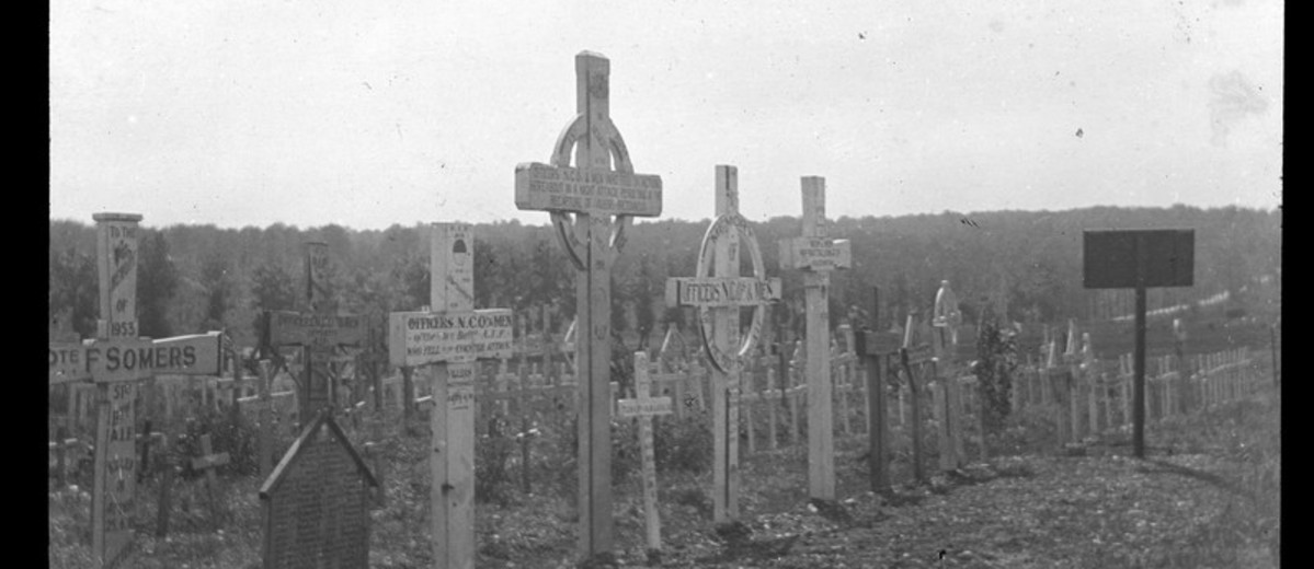 Image: black and white picture of grave site crosses