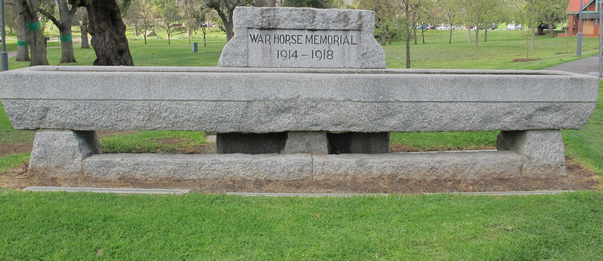 Image: large concrete trough engraved with memorial dates