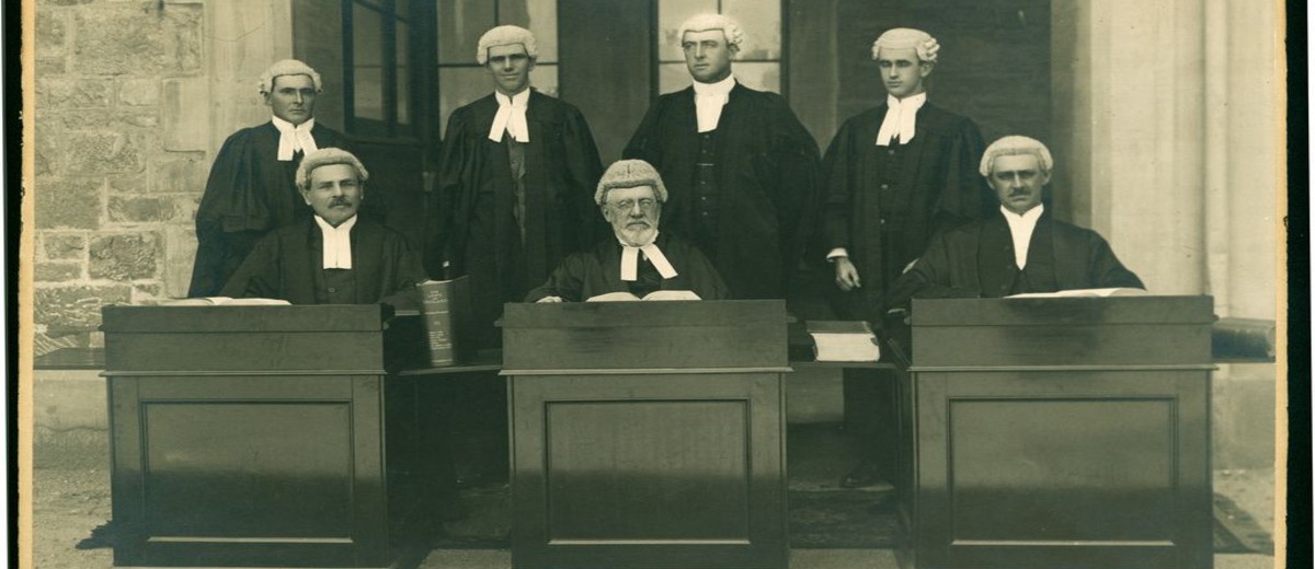 Image: Seven bewigged and robed supreme court judges, seated and posing for photograph, 1915