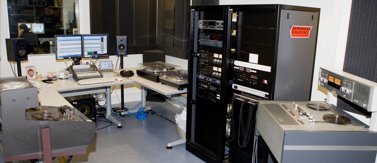 Image: audio preservation room filled with computers and other equipment such as playback systems