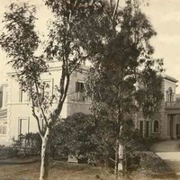 Image: Black and white photograph showing driveway and entrance porch at front of large two-storey building