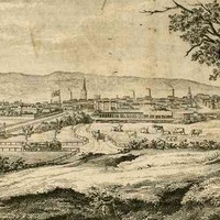 Image: a drawing of a small city as seen from a low hill