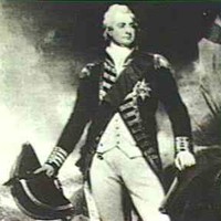 Image: photograph of a man standing amongst rocks and trees wearing a white wig, and a dark military style coat and sash over a cream waistcoat and breeches. He is holding a large hat and sword in one hand and a gun in the other/