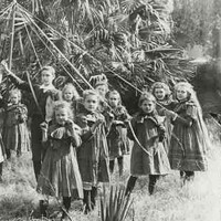 Image: Children dancing around a maypole