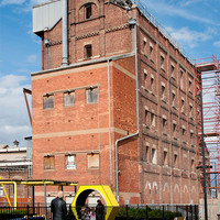 Image: large red brick building several stories high