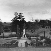 Image: walled garden with stone statue in middle