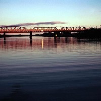 Image: bridge over river at sunset