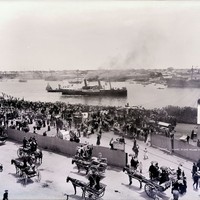Image: Crowds of people at wharf where steam ship is docked