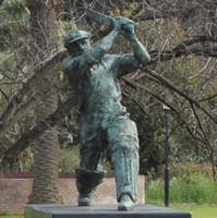 Image: A bronze statue of a cricket batsman standing in a ‘driving’ pose