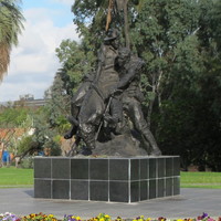 Image: sculpture of man on donkey carrying another man