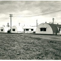 Image: row of curved tin buildings
