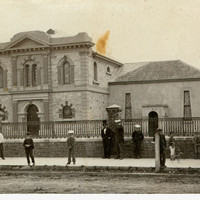 Image: people standing in front of buildings