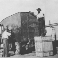 Image: two men washing a large van