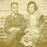 Sepia image of a man and woman sitting together