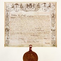 Image: Old document in browning ink with large wax seal attached at bottom