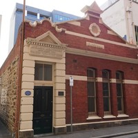 Image: brick building with peaked front