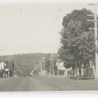Image: view of street with poles lining each side