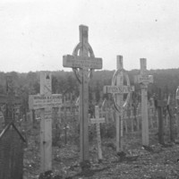 Image: black and white picture of grave site crosses