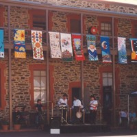 Image: building displaying banners from first floor balcony