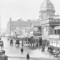 Image: Busy street scene with advertising on arcade dome