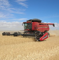 Image: A harvester in the process of harvesting a crop