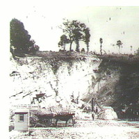Image: Photo of a quarry with horse and carts and workmen  