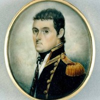 Image: a round miniature watercolour of the head and shoulders of a man with short dark brown hair posed in 3/4 profile wearing a high collared black military style coat with gold epaulettes, piping and buttons over a white shirt