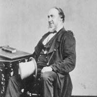 Image: Black and white photograph of older man on a chair, circa 1860
