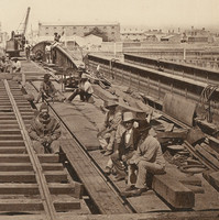 Image: A construction crew works on a bridge in a nineteenth-century port. A hard-hat diver and two well-dressed men are seated at centre right. Tall ships are visible in the adjacent river