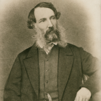 Image: Black and white photograph of a seated man in mid nineteenth century attire.