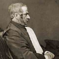 Image: Photograph of seated man in profile.