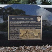 Close-up of plaque on East side of West Terrace