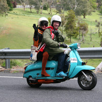 Image: two people on a motor scooter