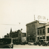 Image: View of shop fronts and cars along currie street