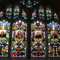 Scientific window, featuring portraits of eminent scientists, Watt, Newton, Stephenson, Bessamer, Brookman Building, 2013