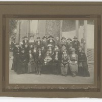 Image: A black and white photograph containing an image of Deborah Moulden amongst her committee members for the S.S. & Nurses' Relatives Association. 