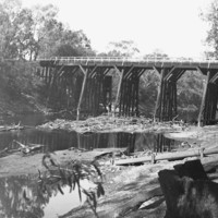 Image: bridge with river underneath it and irrigation works
