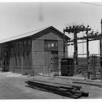 Image : Building with wooden power poles and transformers