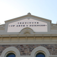 Image: A large, two-storey stone building with the words ‘Institute of Arts & Sciences’ painted on its front façade 